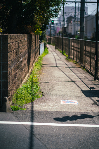 Path by the railroad tracks in Tokyo.