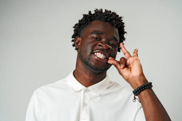 istock African Man Making a Hush Gesture With Finger 2134619724
