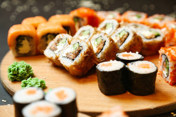 istock Wooden Plate With Assorted Sushi Rolls and Nigiri 2134628021
