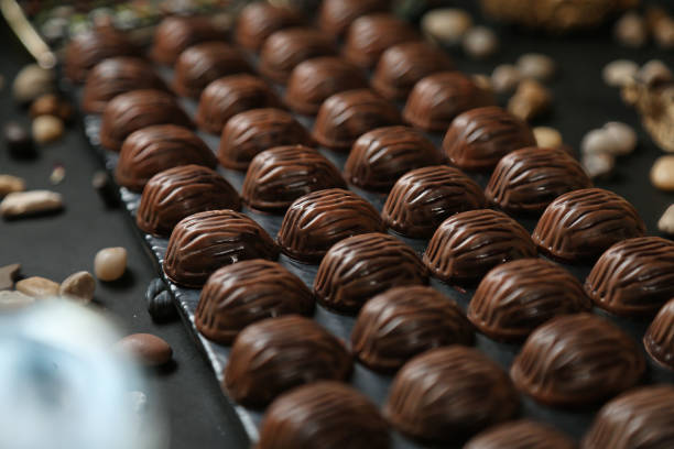 Chocolates Being Aligned on a Conveyor Belt