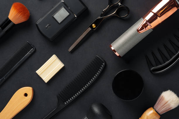 istock An Assortment of Professional Hairdressing Tools Laid Out on a Dark Surface 2134660111