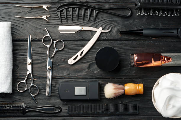 istock Professional Barber Tools Laid Out on Dark Wooden Surface 2134688208
