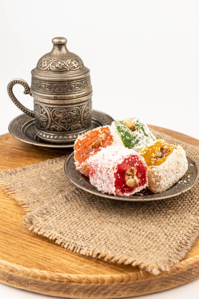 istock Turkish Coffee with Turkish Delight on authentic metal plate, isolated on white background 2134697874