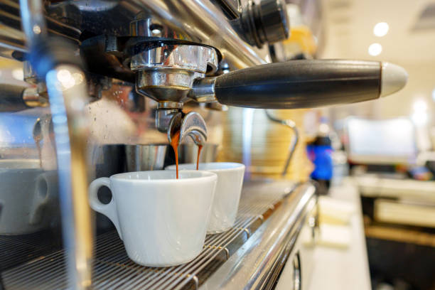 istock Preparing Espresso in a Modern Cafe During Busy Morning Hours 2134698416