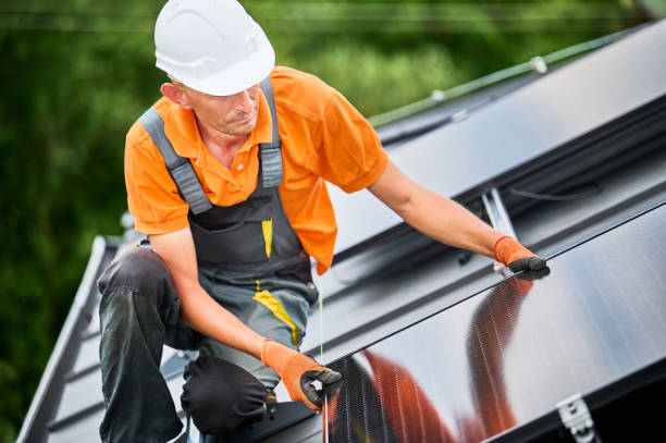 istock Workers building solar panel system on roof of house. Men installing photovoltaic solar module 2134723082