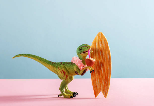 istock Cute dinosaur drinks coconut water and holding surf board. Summer vacation card. 2134726794