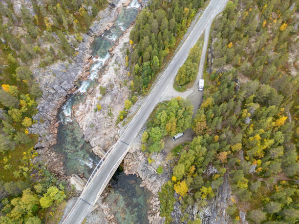 istock Bridge Spanning a Rocky River in Autumn 2134746457