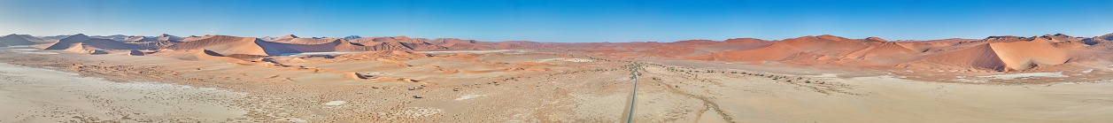 Drone panorama over the Sossusvlei and the surrounding dunes of the Namib Desert in Namibia during the day in summer