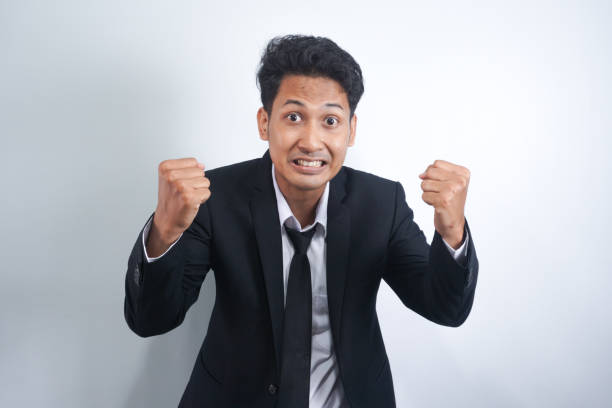 istock Angry man gesturing angrily raising hands and shouting loudly expressing anger after quarrel with boss or employee in suit isolated over white background. Feel my anger 2134810778