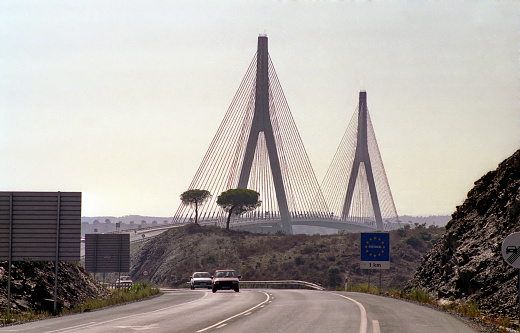 view of the European road E1 and suspension bridge over Guadiana river  between Spain and Portugal