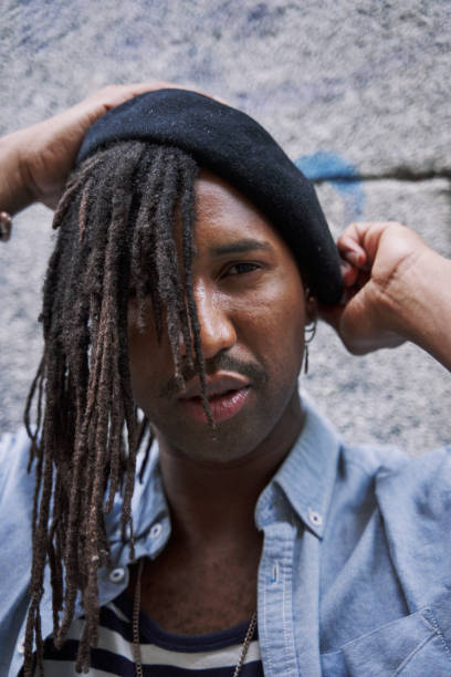 istock Serious African American male with dreadlocks and eyeglasses while looking away 2134845347