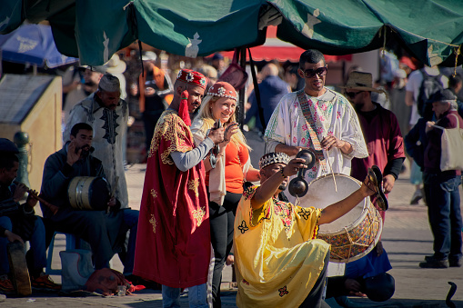 marrakech, Morocco – April 01, 2024: A group of Moroccan citizens playing Moroccan iron castanets called Karkaba