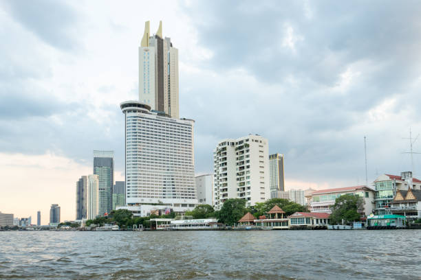 Skyscrapers on the banks of the Chao Phraya River, Bangkok, Thailand, view from the boat.