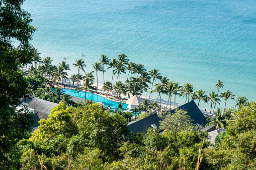 White Sand Beach resort view from above with palm trees and blue sea in Koh Chang Island
