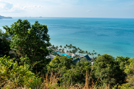 White Sand Beach resort view from above with palm trees and blue sea in Koh Chang Island