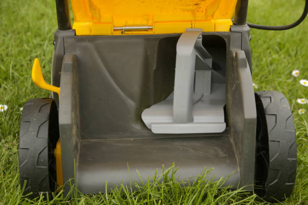 istock Close up image of lawn mower with inserted mulching plug, a cutting function that finely shreds the clippings and spreads it over the ground as a fertiliser. 2134898302