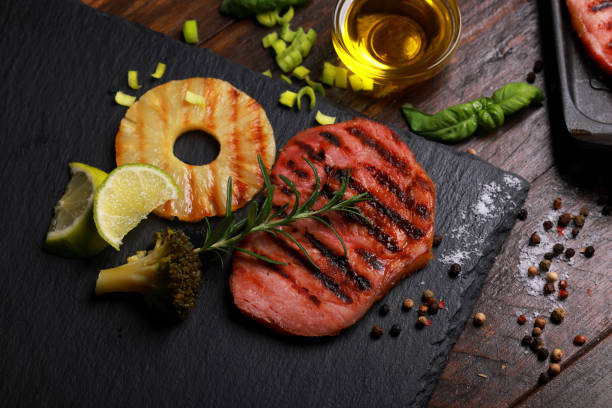 Pork Fillet with Pineapple Rings on slate platter