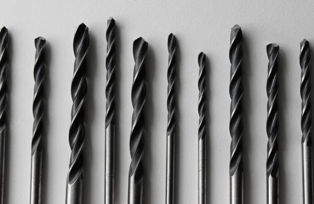 istock Steel Bits For Drill Driver Laid Out In Order On White 2134928453