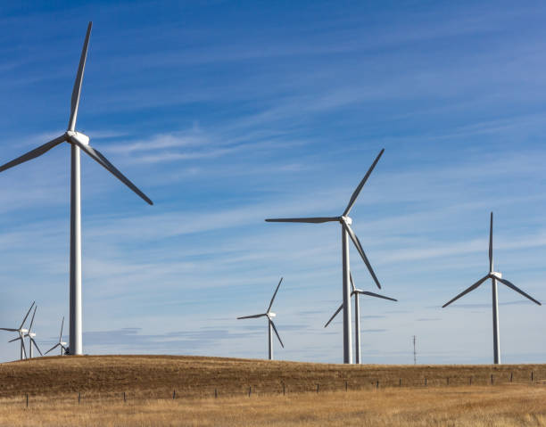 istock Eight Wind Turbines on Southern Alberta prairie with a communication tower in background 2134935453