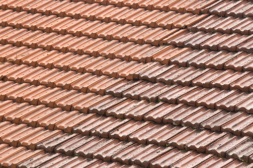 Detail of a roof with tile called marseilles, the first global roofing standard - Roof with double pitch and self-fitting flat tiles, Marseille model.