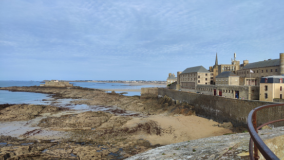 Photography of coastal beach landscape with rock formations in Saint Malo, France
