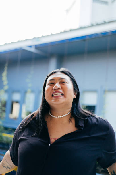 istock Woman Laughing With Head Thrown Back 2135001137