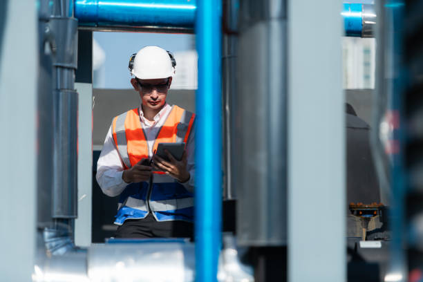 istock Engineers inspect the completed air conditioning and water systems to continue verifying their functionality. 2135001695