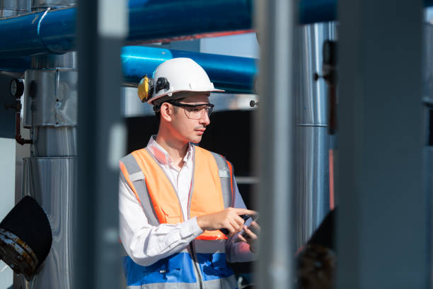 istock Engineers inspect the completed air conditioning and water systems to continue verifying their functionality. 2135002228