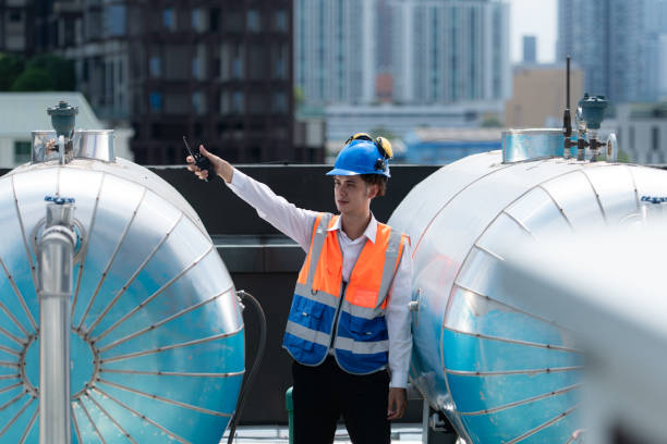 istock Engineers inspect the completed air conditioning and water systems to continue verifying their functionality. 2135004417