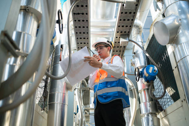 istock Engineers inspect the completed air conditioning and water systems to continue verifying their functionality. 2135006529
