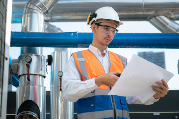 istock Engineers inspect the completed air conditioning and water systems to continue verifying their functionality. 2135007047