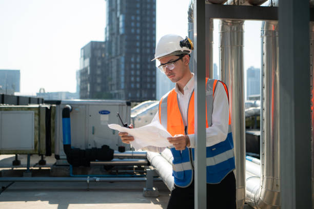 istock Engineers inspect the completed air conditioning and water systems to continue verifying their functionality. 2135007578