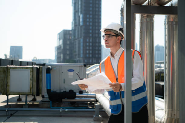 istock Engineers inspect the completed air conditioning and water systems to continue verifying their functionality. 2135007641