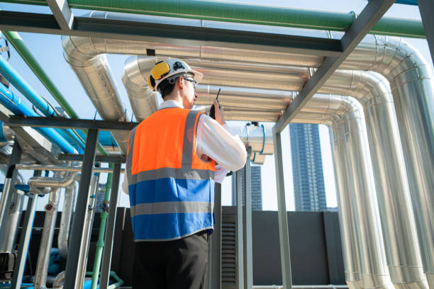 istock Back view of Engineers inspect the completed air conditioning and water systems to continue verifying their functionality. 2135009131