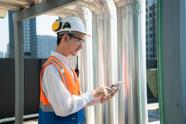 istock Engineers inspect the completed air conditioning and water systems to continue verifying their functionality. 2135009652