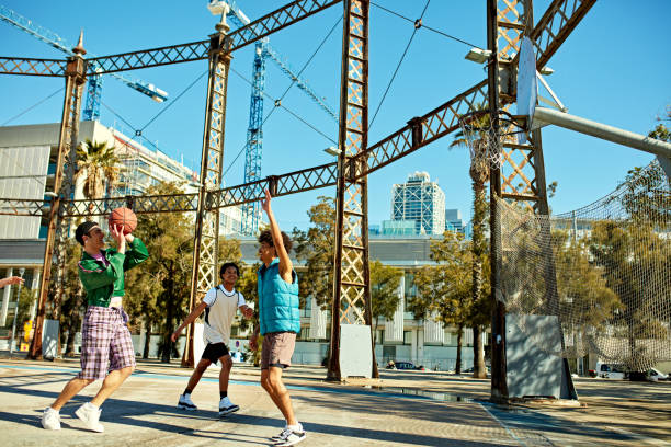 New York City World Trade Center skyscraper tower building, Manhattan Downtown Financial district, USA. Hudson River Park basketball court. Basket ball hoop and blackboard. Outdoor streetball sport.