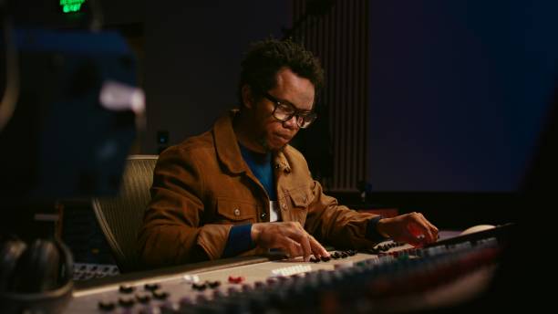 istock Music producer using audio mixer in professional studio 2135035652