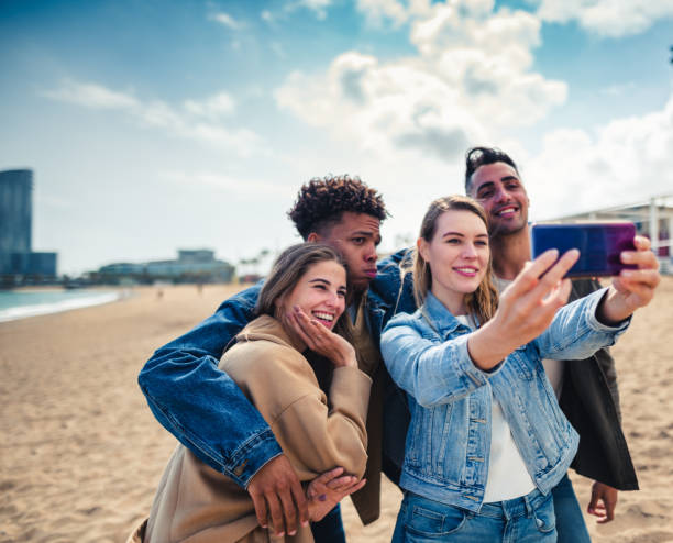 istock friends all together take a selfie on the beach 2135041966