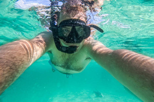 istock Young Man Taking Selfies While Snorkeling In The Sea At The Phi Phi Islands In Thailand 2135044600