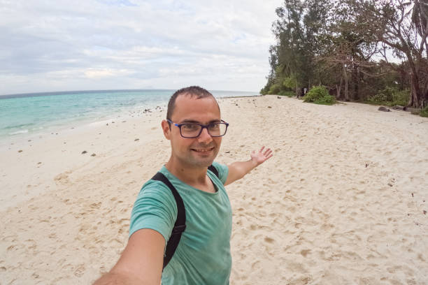 istock Young Man Taking Selfies On The Beach In Thailand 2135049468