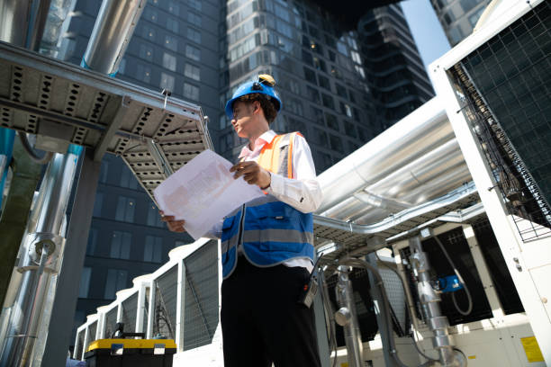istock Engineers inspect the completed air conditioning and water systems to continue verifying their functionality. 2135051161