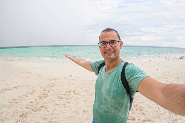 istock Young Man Taking Selfies On The Beach In Thailand 2135052214
