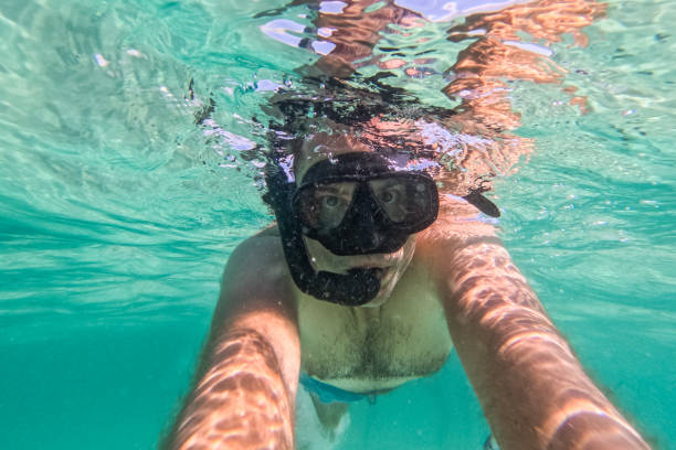 istock Young Man Taking Selfies While Snorkeling In The Sea At The Phi Phi Islands In Thailand 2135053316