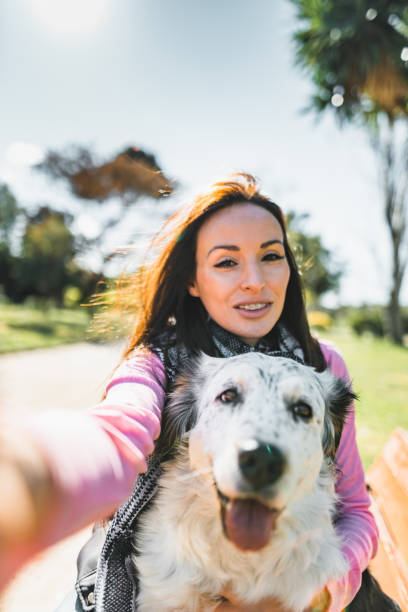 istock woman take a selfie with the dog 2135054948