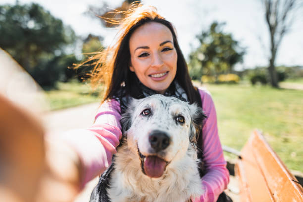 istock woman take a selfie with the dog 2135055513
