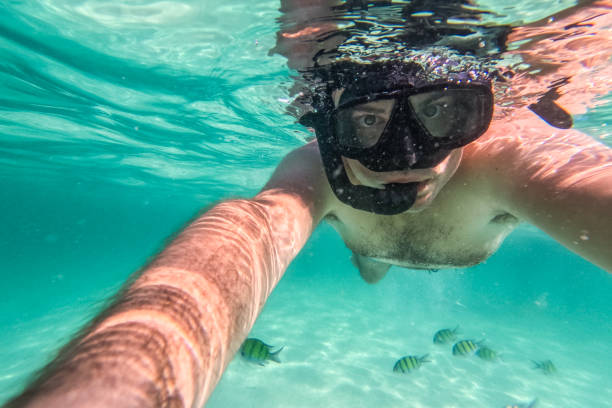 istock Young Man Taking Selfies While Snorkeling In The Sea At The Phi Phi Islands In Thailand 2135056583