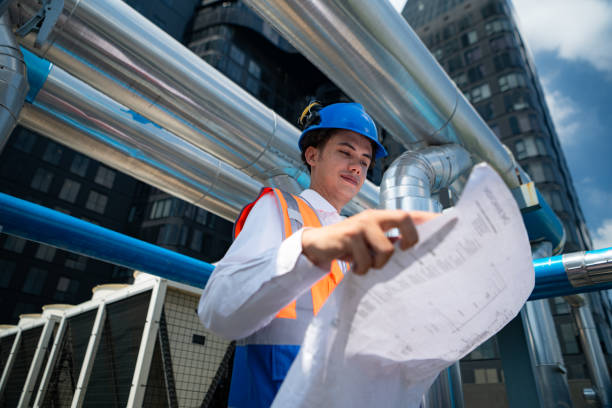 istock Engineers inspect the completed air conditioning and water systems to continue verifying their functionality. 2135059777