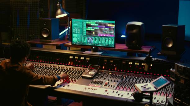 istock African american audio expert adding sound effects on tracks in post production 2135060302