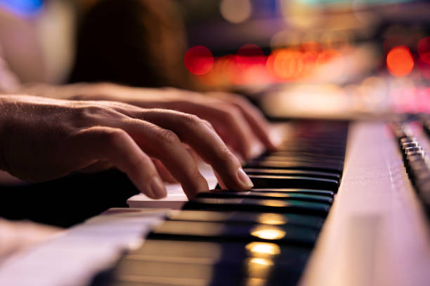istock Musician playing electronic keyboard synthesizer in professional studio 2135072623
