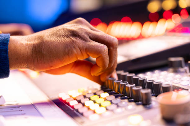 istock African american sound engineer operates audio console in control room 2135074733